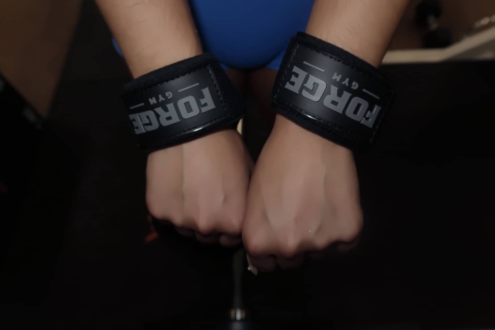 Close detail of FORGE wrist straps wrapped on both wrists