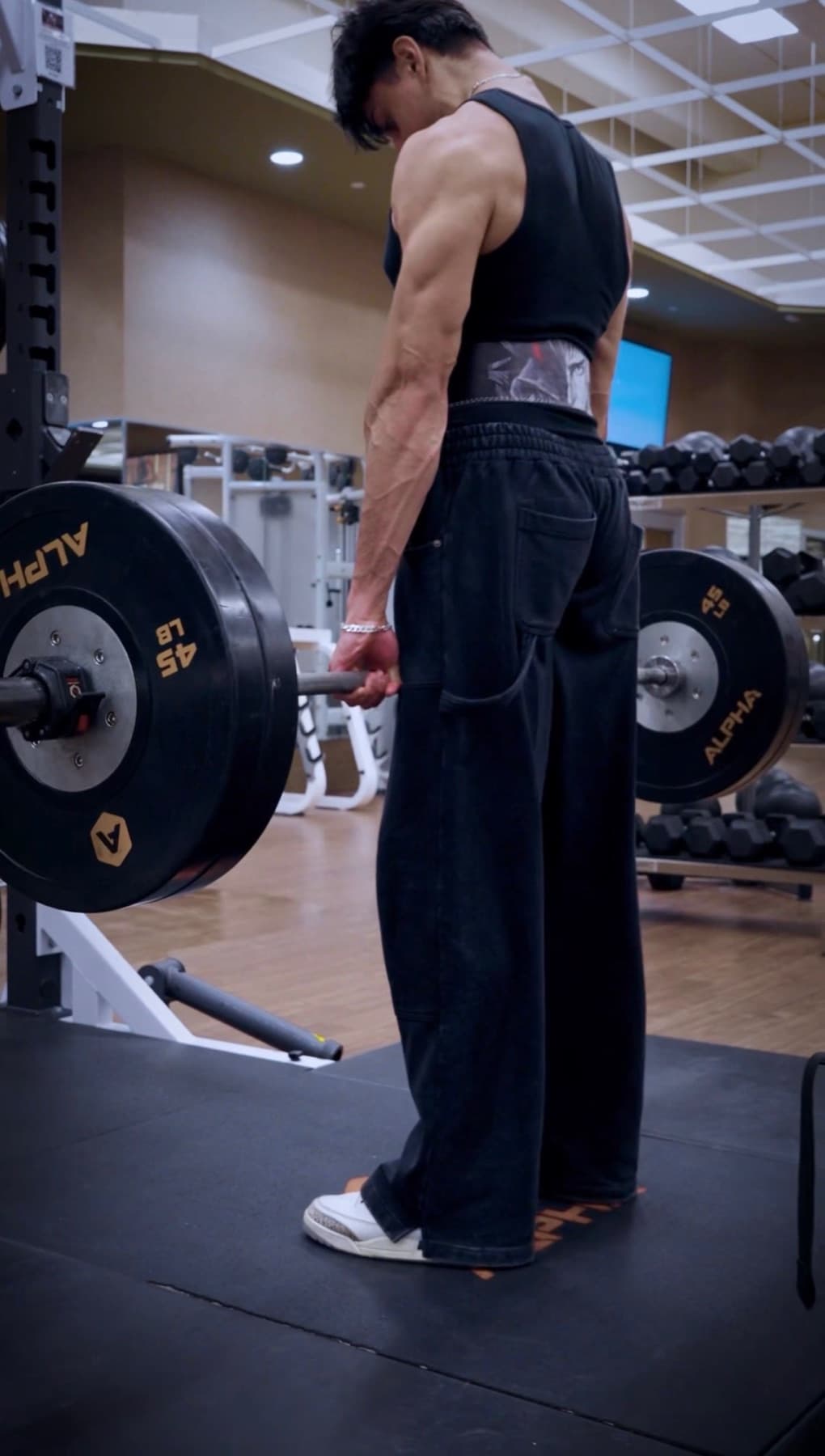 FORGE Berserk lever belt worn during a deadlift setup in the gym.