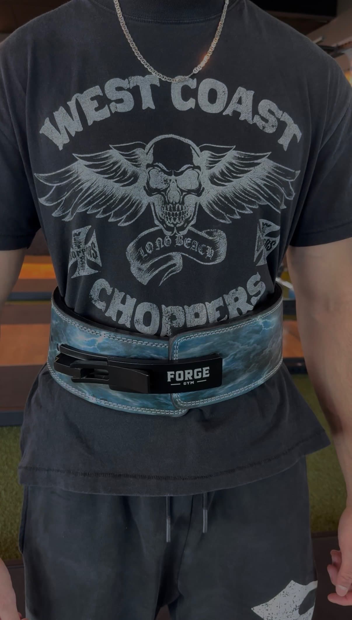 FORGE Zeus lever belt worn at the waist with the lever buckle visible.