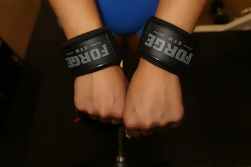 Close detail of FORGE wrist straps wrapped on both wrists
